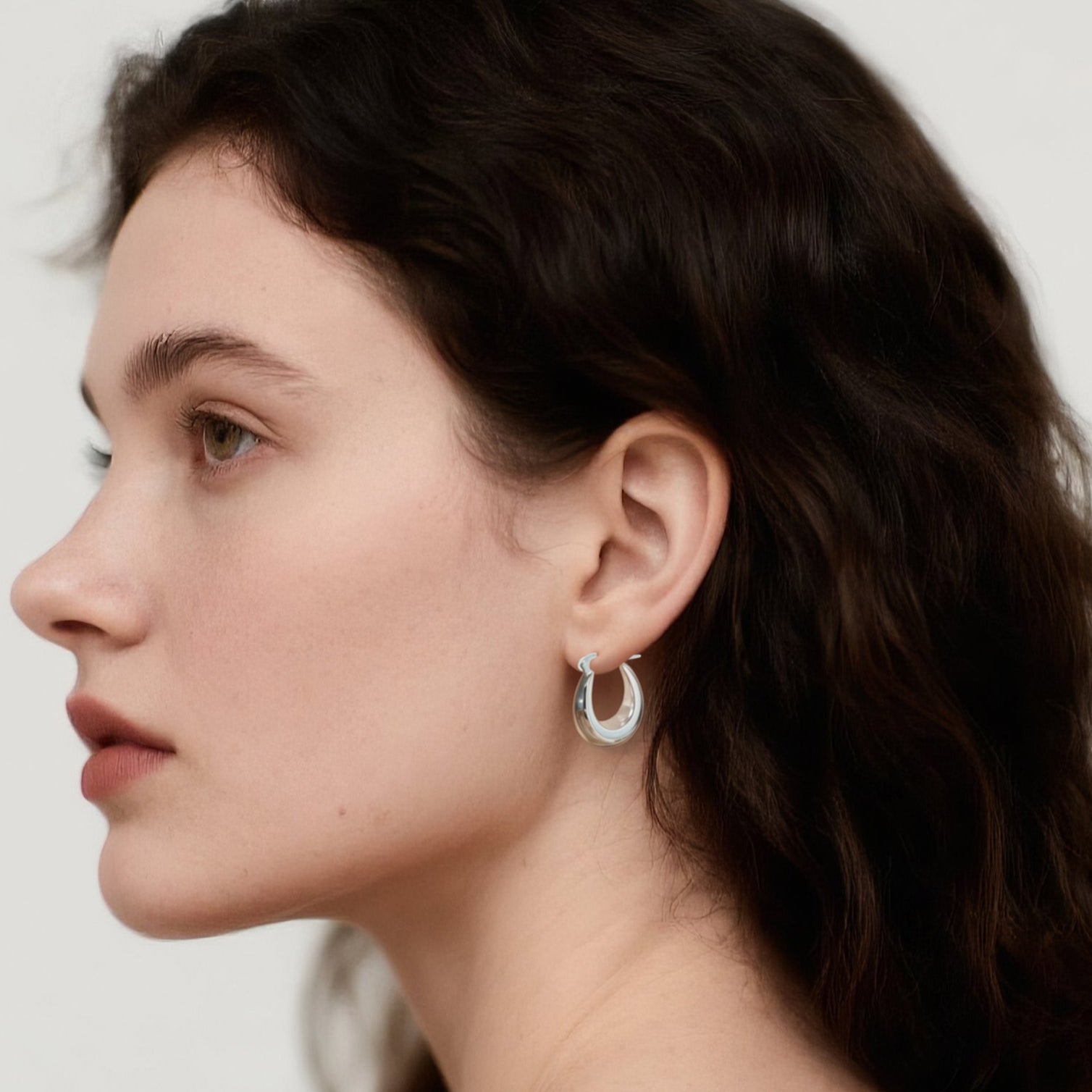 Close-up of Hermin's Silver Puffy Hoops - Paris in sterling silver with rhodium finish, crafted for elegance and durability