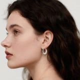 Close-up of Hermin's Silver Puffy Hoops - Paris in sterling silver with rhodium finish, crafted for elegance and durability