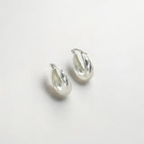 Close-up of Hermin's Silver Puffy Hoops - Paris in sterling silver with rhodium finish, crafted for elegance and durability