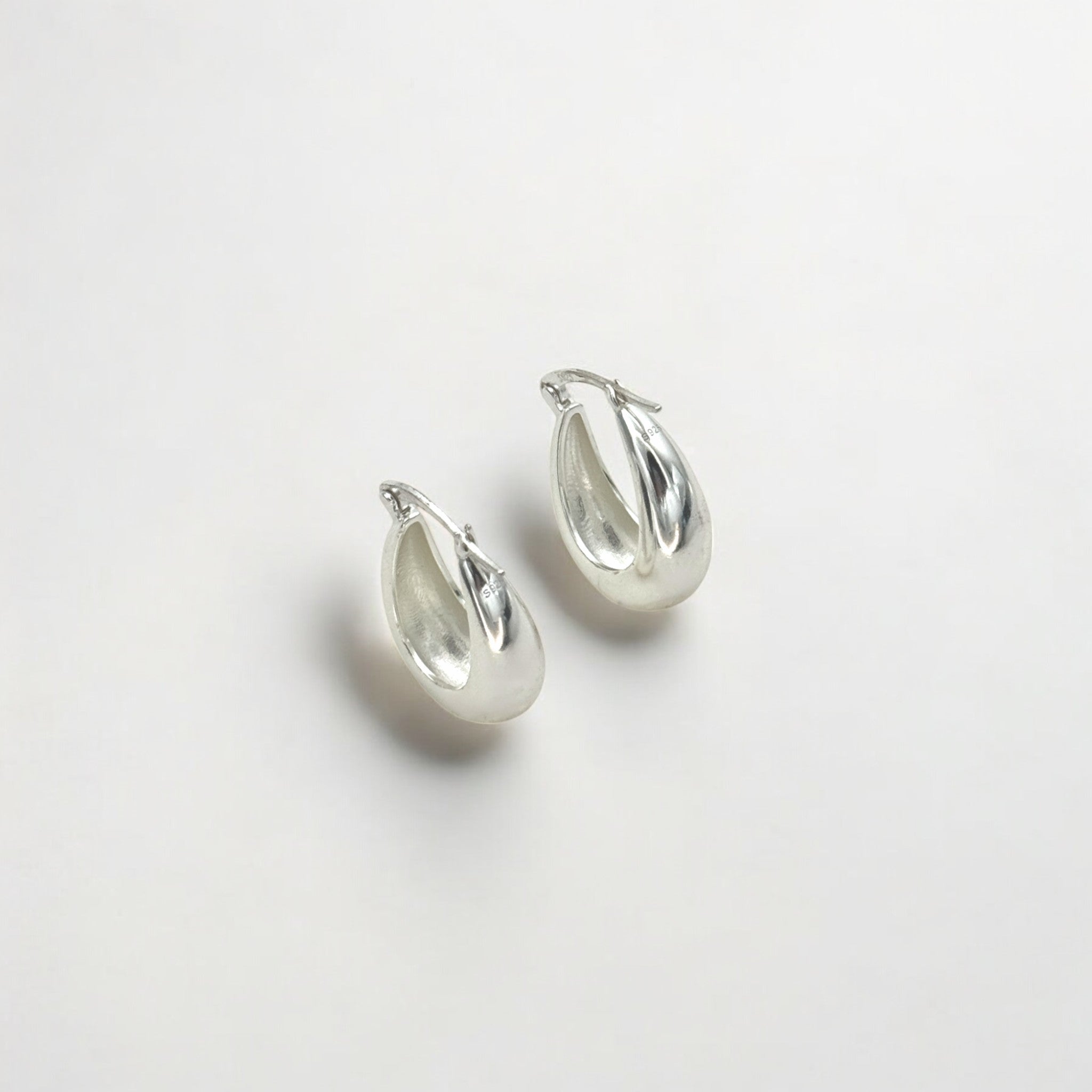 Close-up of Hermin's Silver Puffy Hoops - Paris in sterling silver with rhodium finish, crafted for elegance and durability