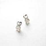 Everyday Silver Twist Huggies - Paris made from sterling silver with rhodium finish, minimalist design by Hermin Jewelry