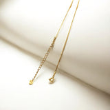 Close-up of Hermin's Gold Kinetic Bar Necklace - Dew in 18k gold vermeil over sterling silver, crafted for elegance and durability