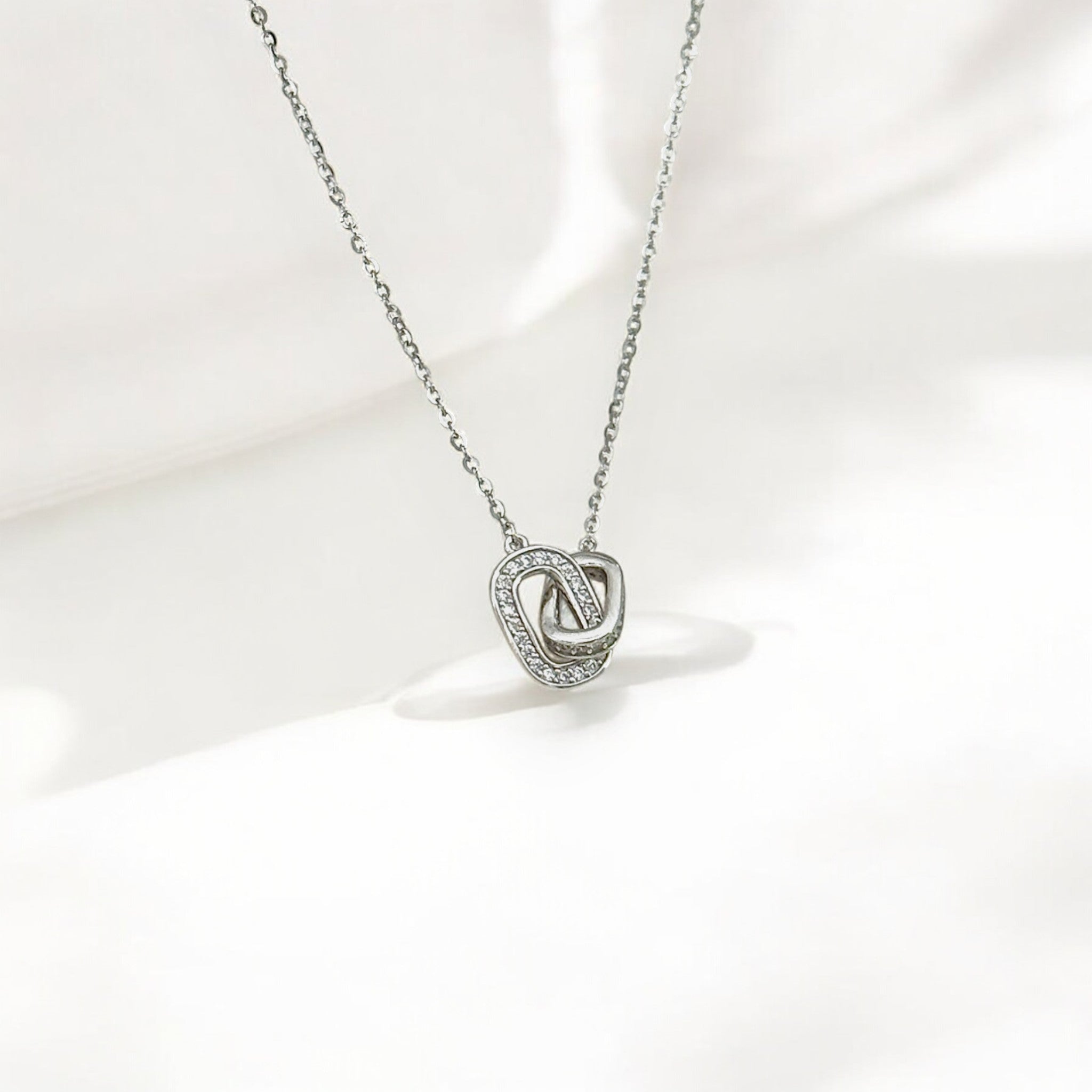 Close-up of Hermin's Eternal Bond - Mini Pavé Link Silver Necklace in sterling silver with rhodium finish, crafted for elegance and durability