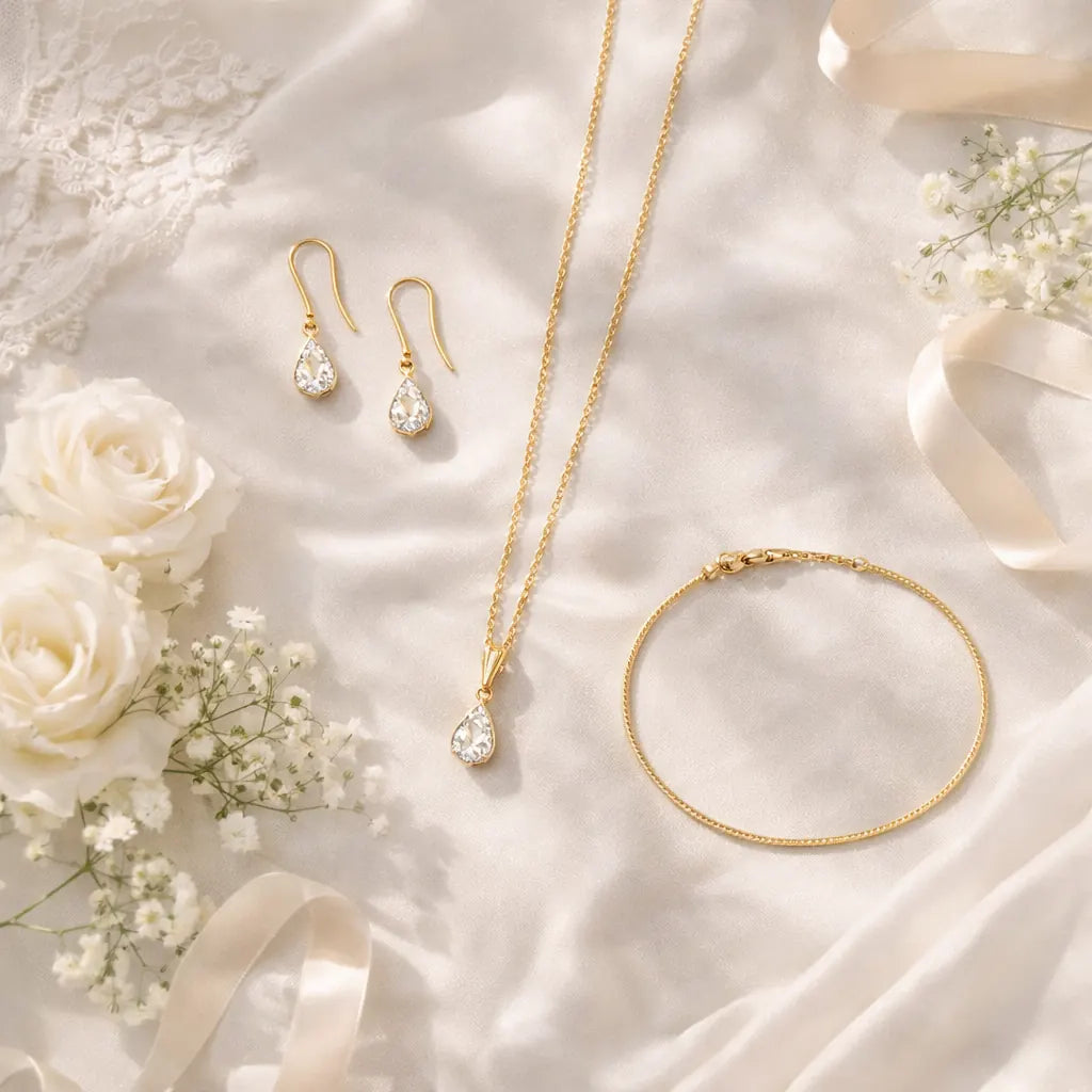 Affordable bridal wedding jewelry set - gold vermeil earrings necklace and bracelet on white silk with wedding flowers and lace