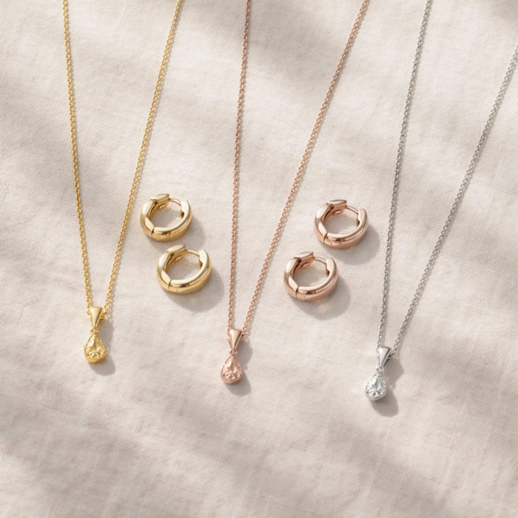 Gold vermeil jewelry comparison showing yellow gold, rose gold and white gold necklaces and earrings - affordable 14K 18K luxury jewelry