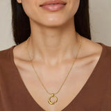 Close-up of Hermin's Gold Curved Circle Necklace - Embrace in 18k gold vermeil over sterling silver, crafted for elegance and durability