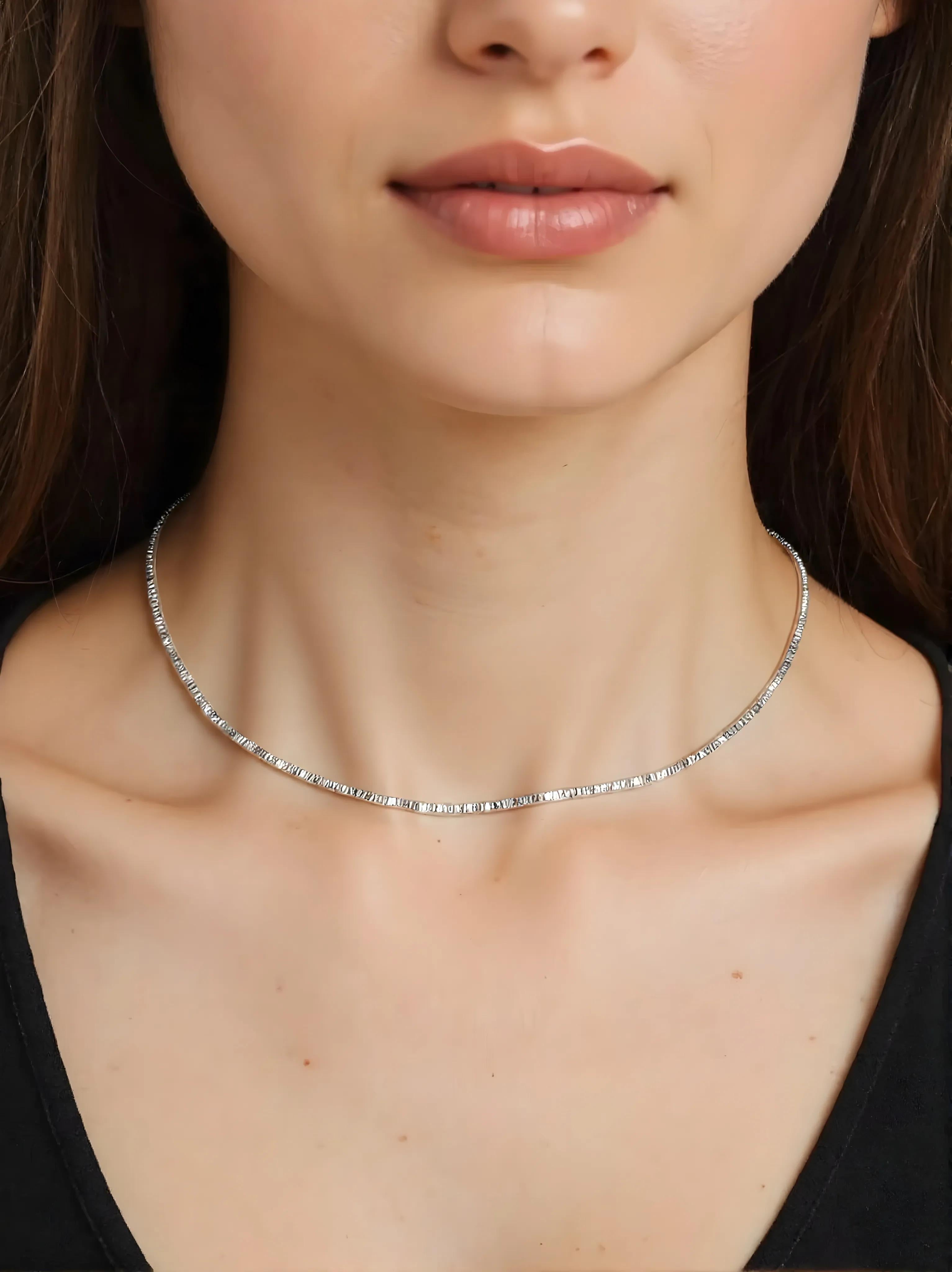 Close-up of Hermin's Faceted Silver Bead Necklace - Gleam in sterling silver with rhodium finish, crafted for elegance and durability