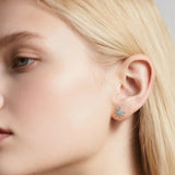 Close-up of Hermin's North Star Silver Stud Earrings in sterling silver with rhodium finish, crafted for elegance and durability