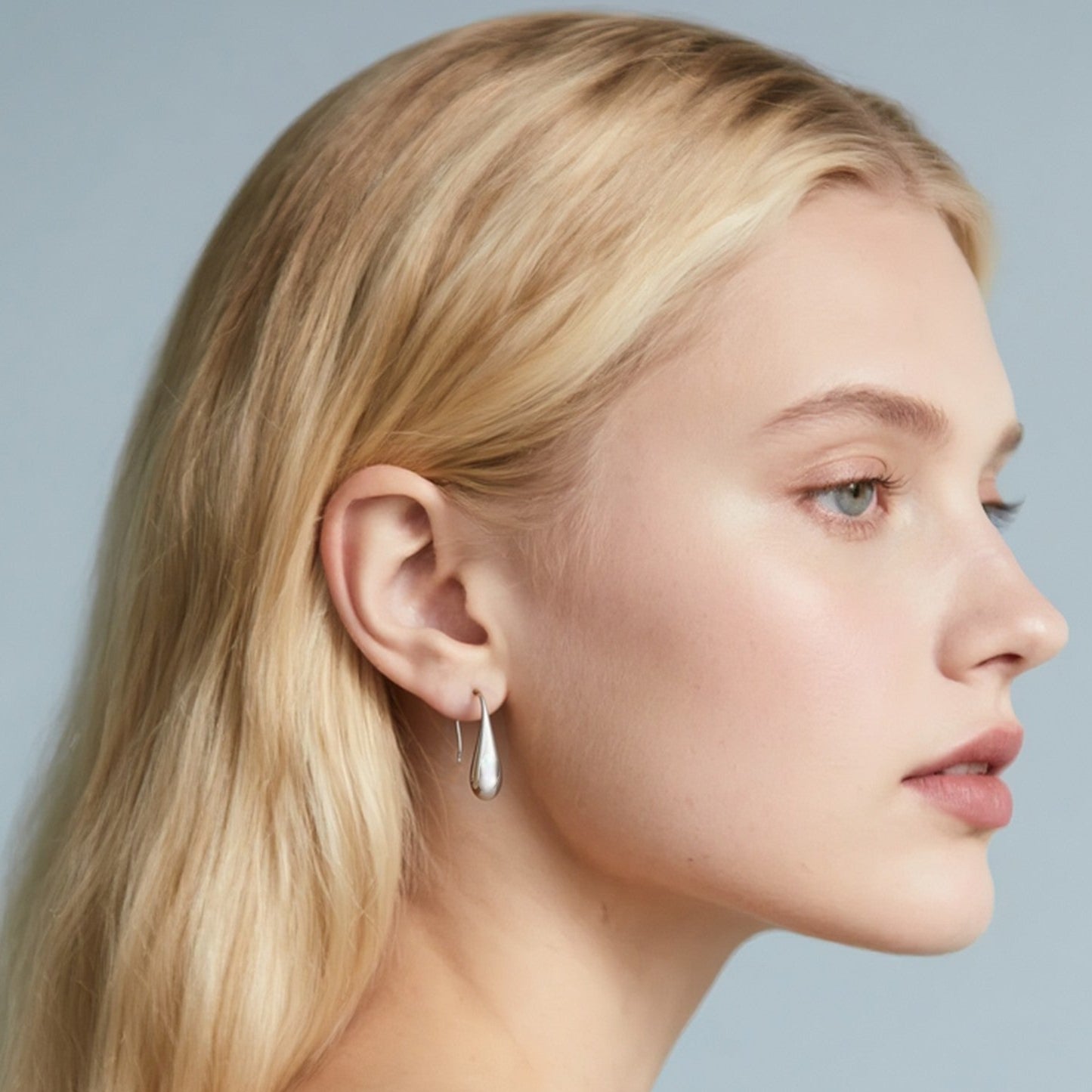 Close-up of Hermin's Silver Threader Teardrop Earrings - Droplet in sterling silver with rhodium finish, crafted for elegance and durability