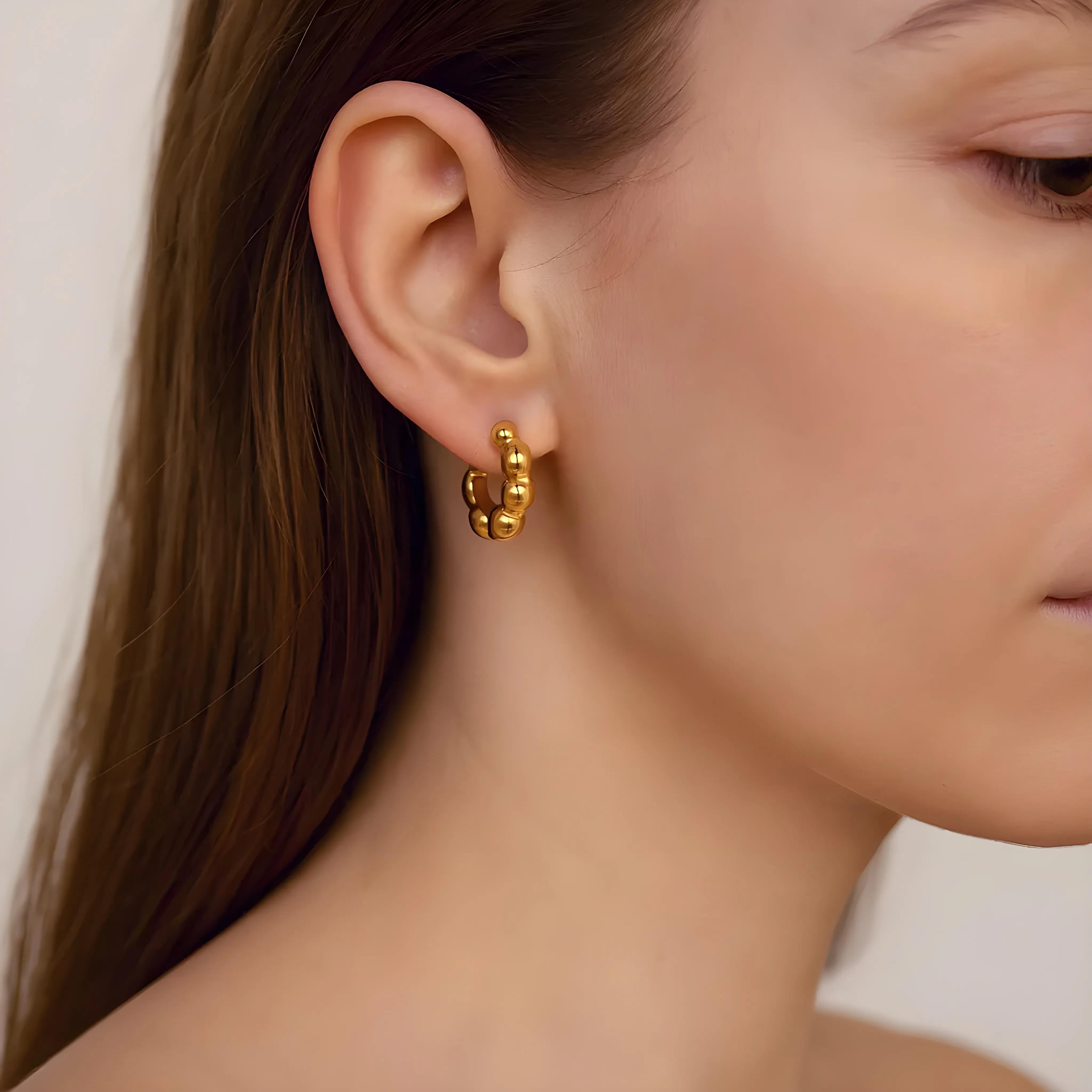 Close-up of Hermin's Beaded Gold Huggies Hoops - Paris in 18k gold vermeil over sterling silver, crafted for elegance and durability