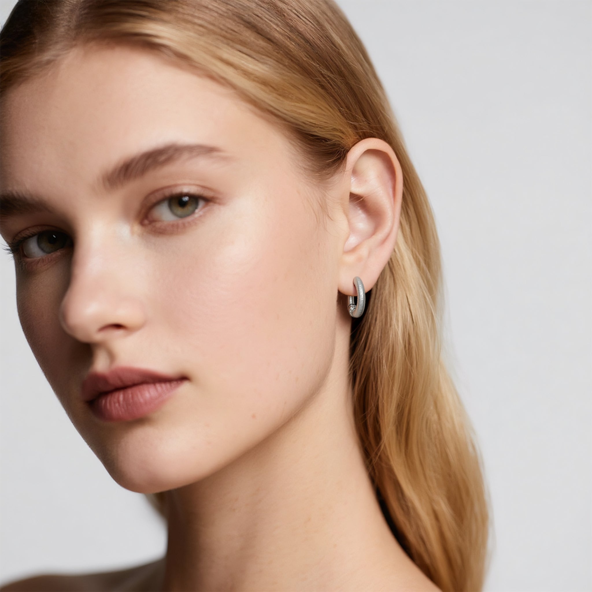 Close-up of Hermin's Tulle Silver Sparkle Everyday Hoops in sterling silver with rhodium finish, crafted for elegance and durability