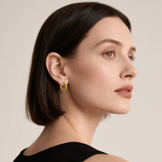 Close-up of Hermin's Braided Gold Huggie Hoops - Paris in 18k gold vermeil over sterling silver, crafted for elegance and durability