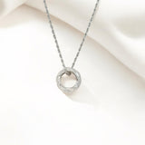 Close-up of Hermin's Tulle Textured Silver Woven Pendant Necklace - Twill in sterling silver with rhodium finish, crafted for elegance and durability