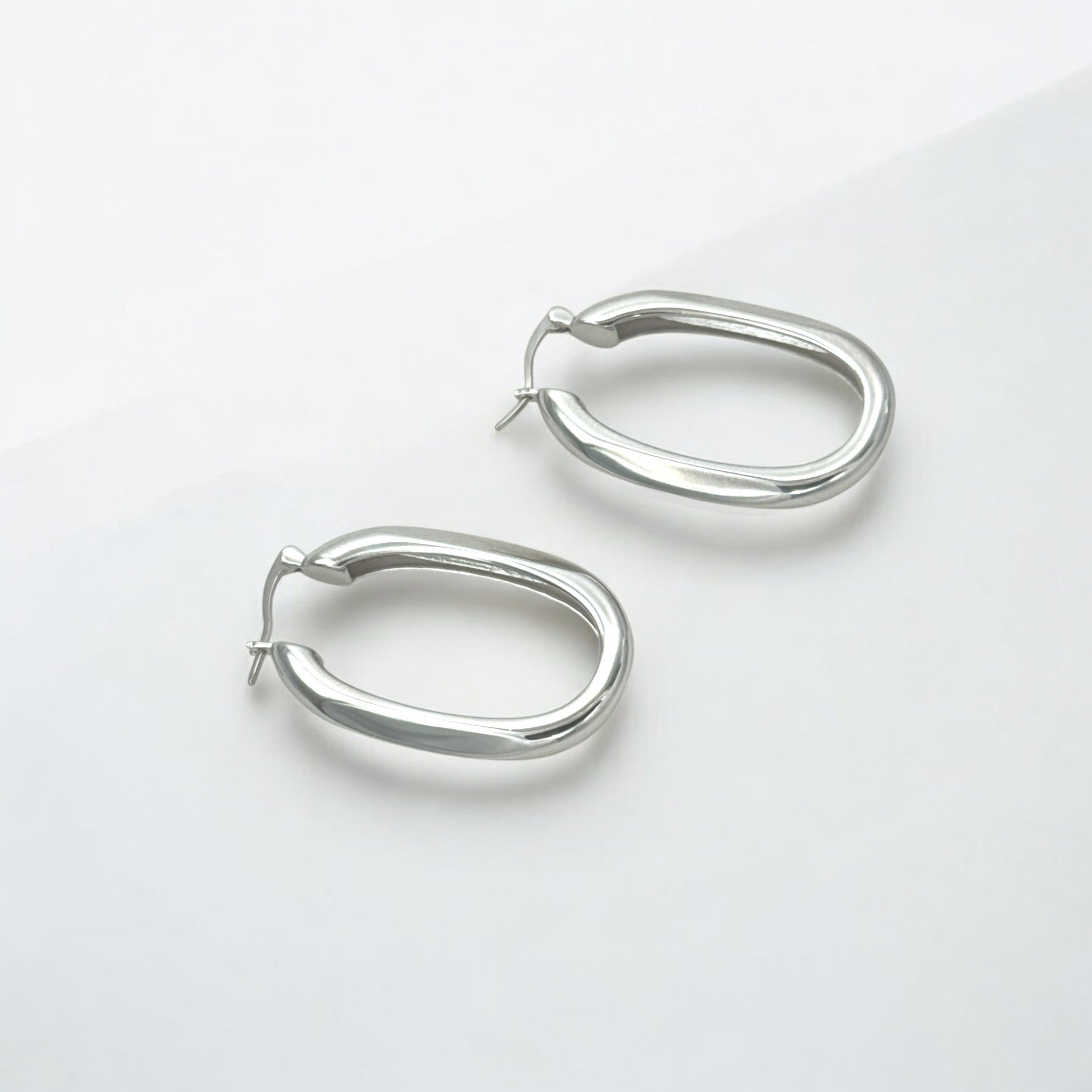 Classic Statement Oval Silver Hoops - Milan made from sterling silver with rhodium finish, minimalist design by Hermin Jewelry