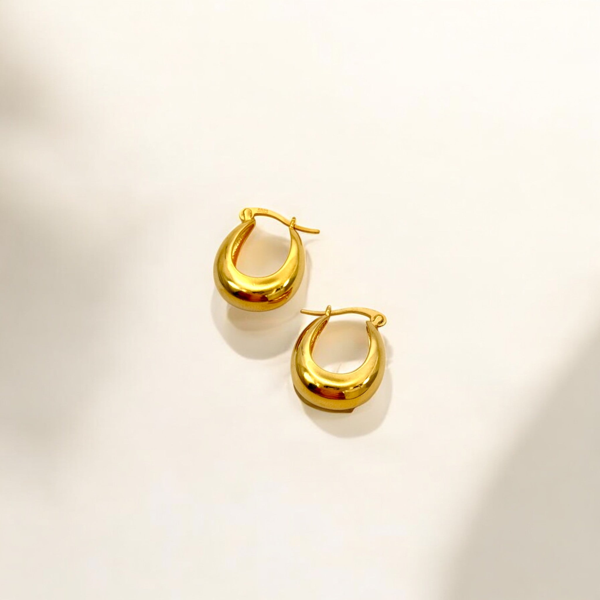 Close-up of Hermin's Gold Puffy Hoops - Paris in 18k gold vermeil over sterling silver, crafted for elegance and durability
