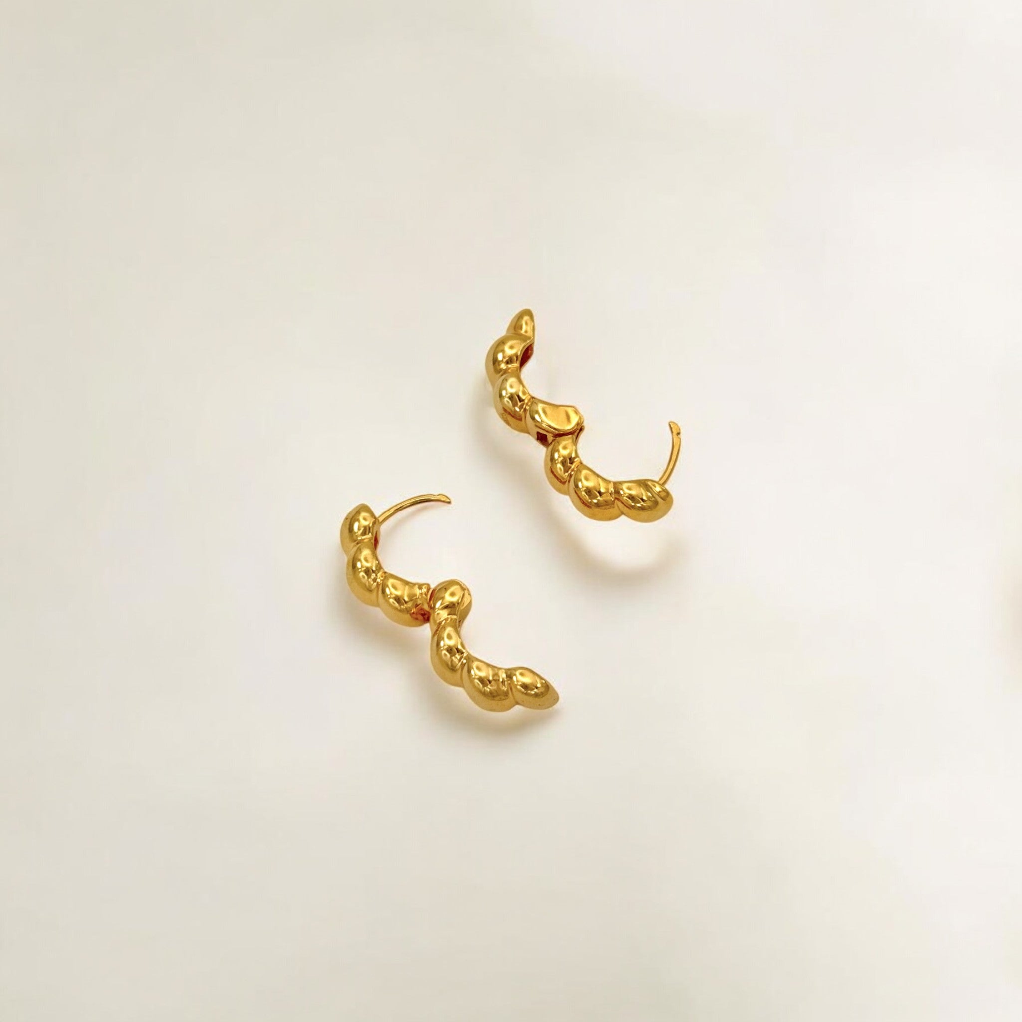 Close-up of Hermin's Beaded Gold Huggies Hoops - Paris in 18k gold vermeil over sterling silver, crafted for elegance and durability