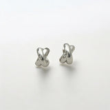 Everyday Silver Twist Huggies - Paris made from sterling silver with rhodium finish, minimalist design by Hermin Jewelry