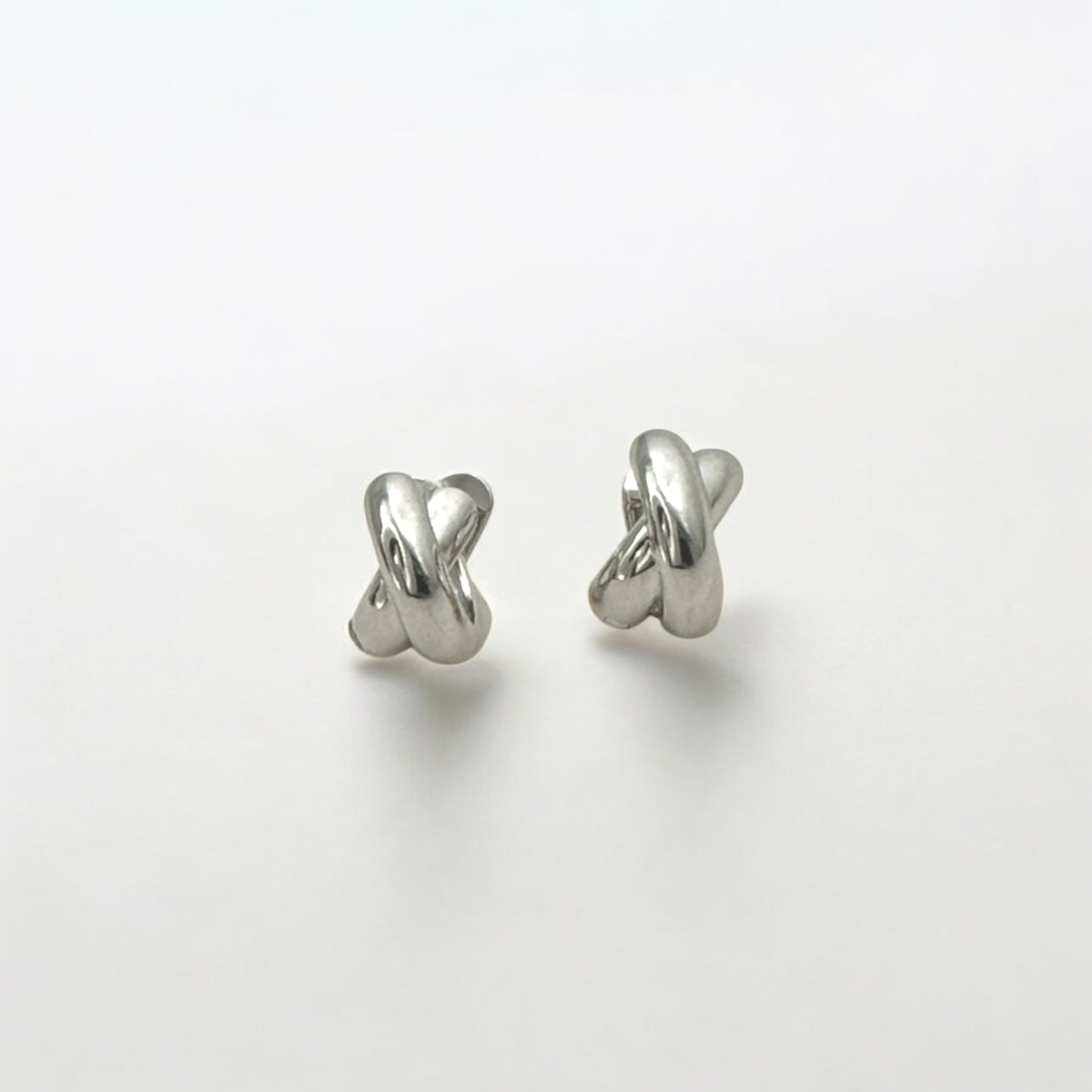 Everyday Silver Twist Huggies - Paris made from sterling silver with rhodium finish, minimalist design by Hermin Jewelry