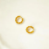 Close-up of Hermin's Braided Gold Huggie Hoops - Paris in 18k gold vermeil over sterling silver, crafted for elegance and durability