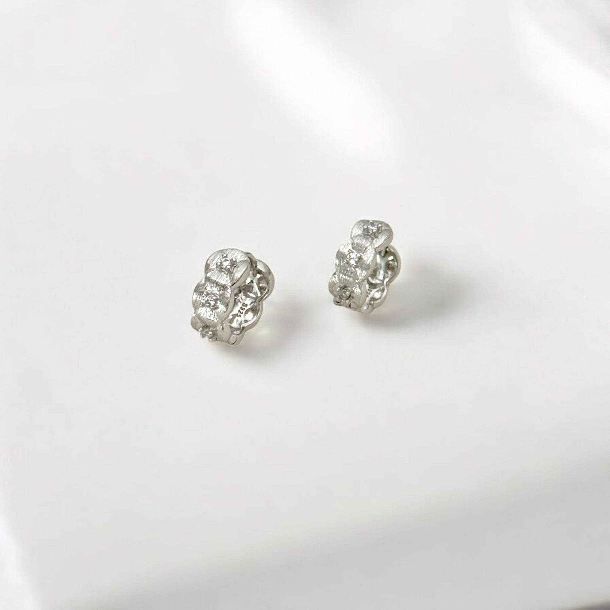 Tulle Textured Silver Woven Sparkle Huggie Hoops made from sterling silver with rhodium finish, minimalist design by Hermin Jewelry