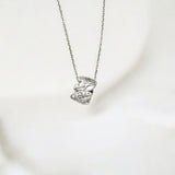 Close-up of Hermin's Silver Sparkle Leaf Pendant Necklace - Olivia in sterling silver with rhodium finish, crafted for elegance and durability