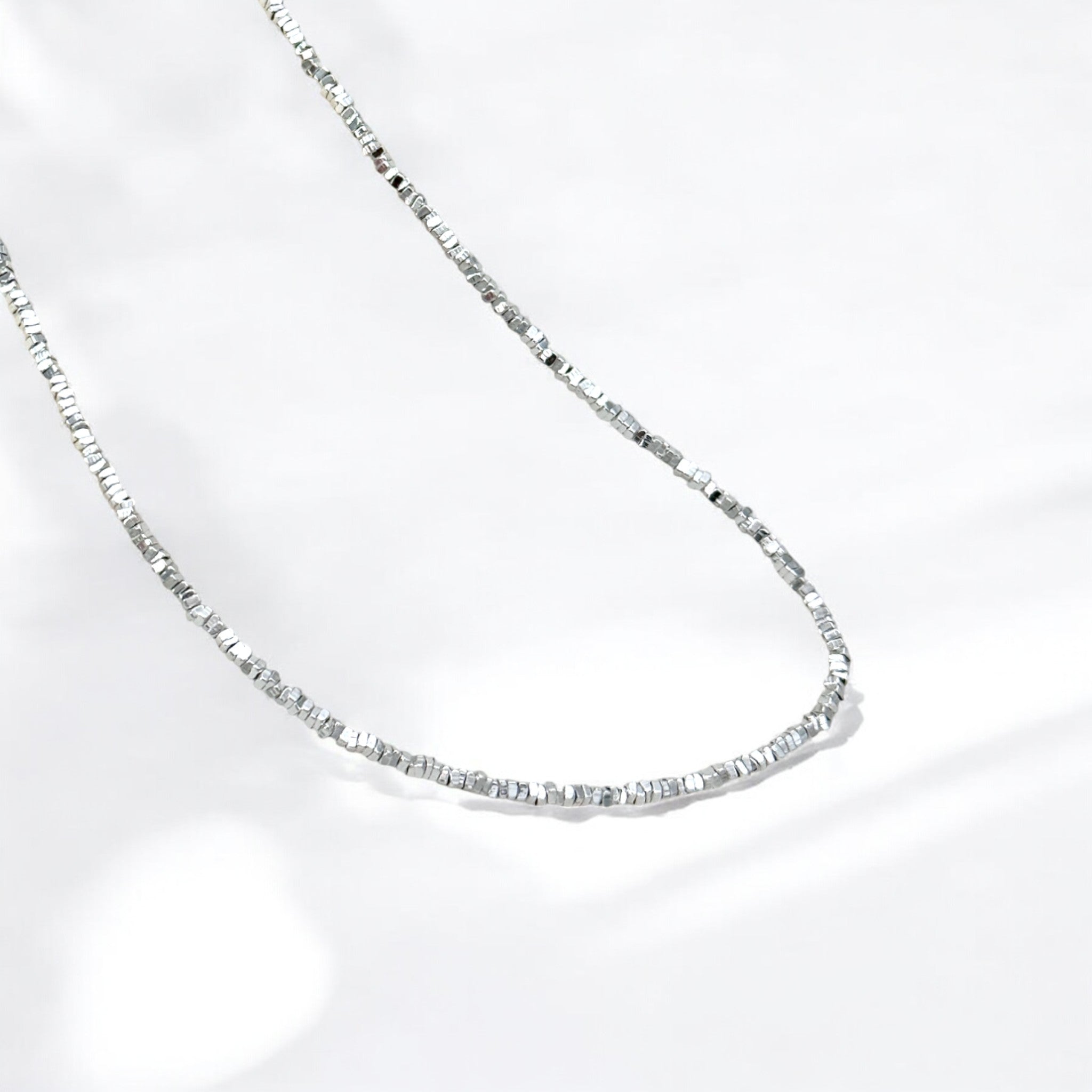 Faceted Silver Bead Necklace - Gleam made from sterling silver with rhodium finish, minimalist design by Hermin Jewelry