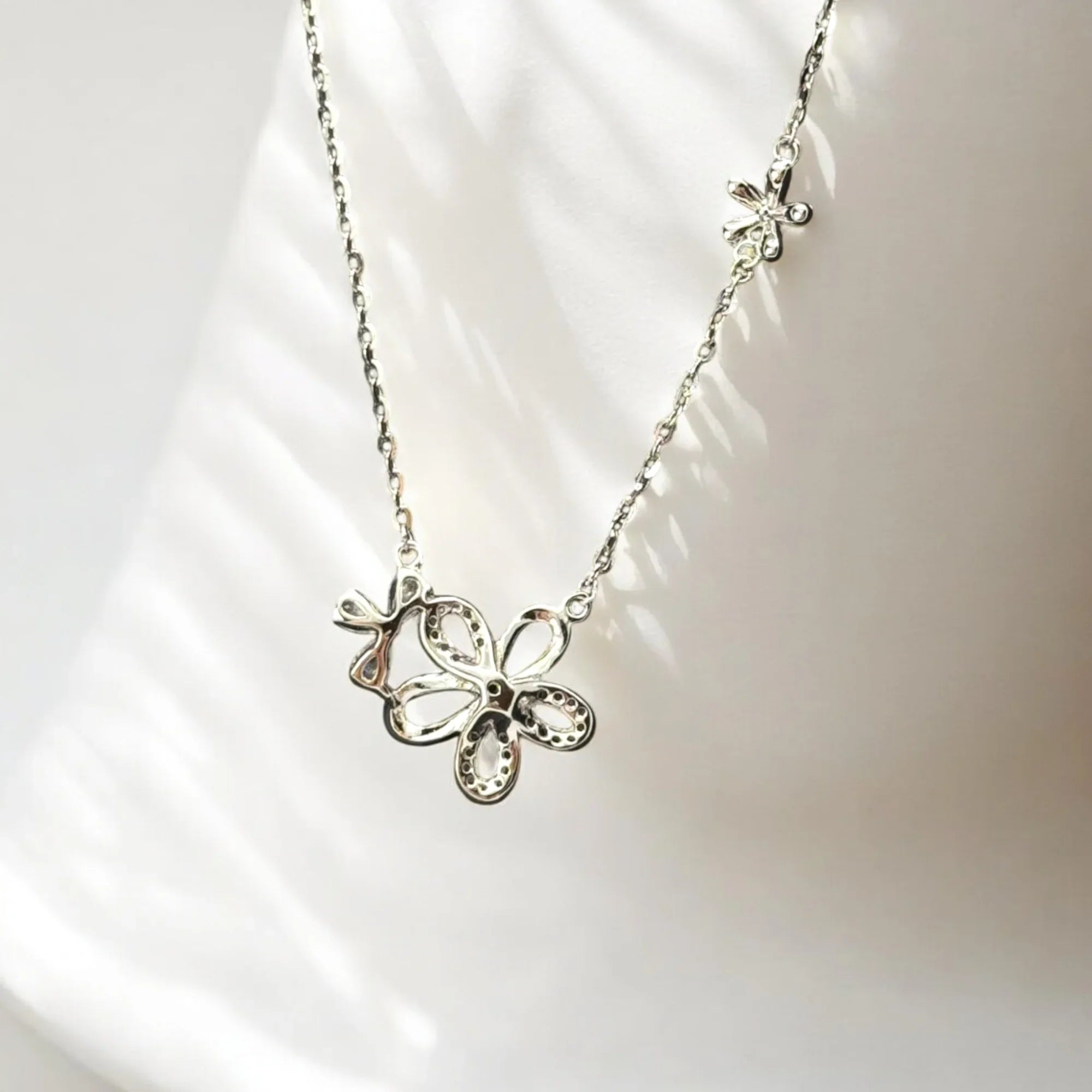 Blossom silver sparkle bloom necklace with CZ flower pendant on sterling silver chain