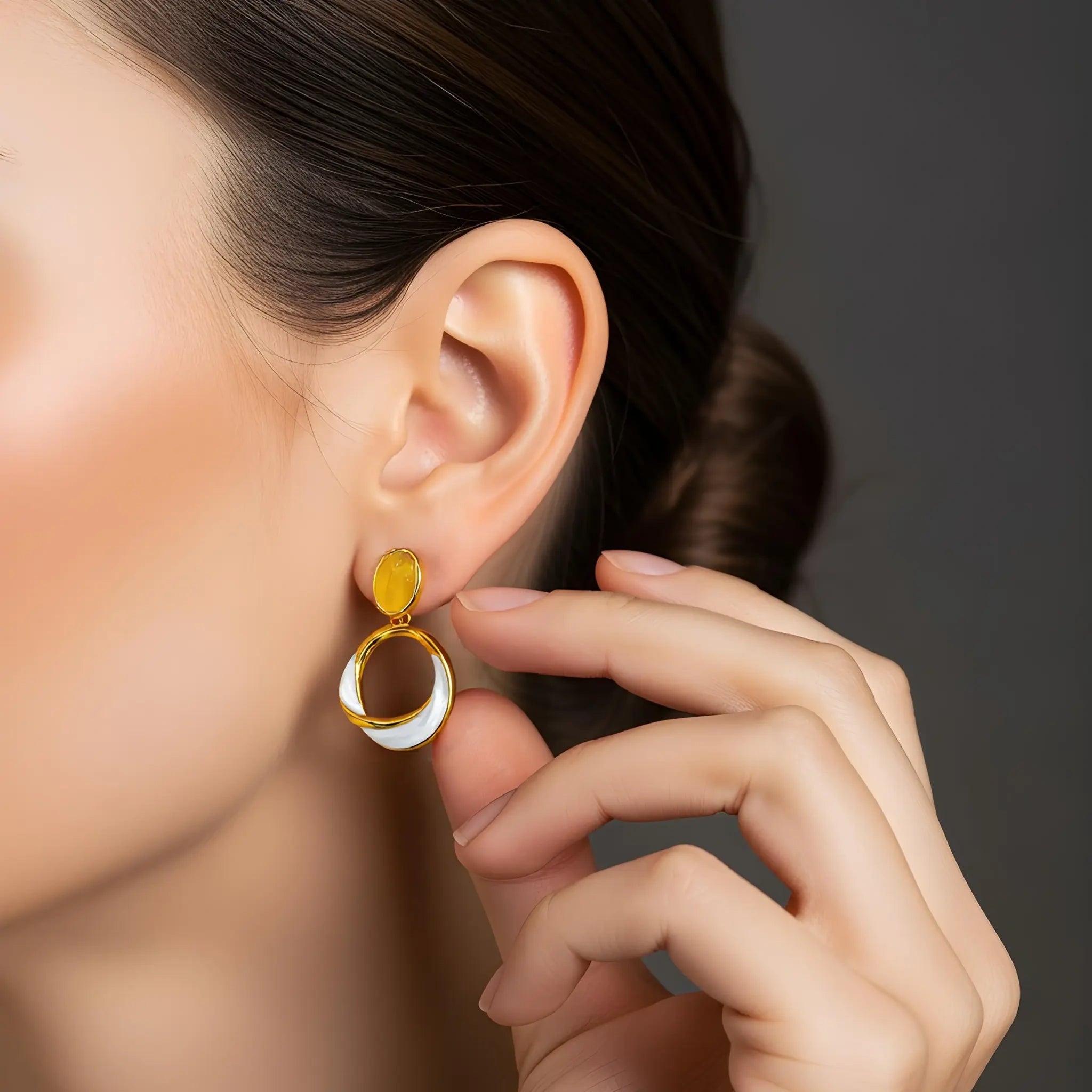 Model wearing gold chalcedony enamel drop earrings
