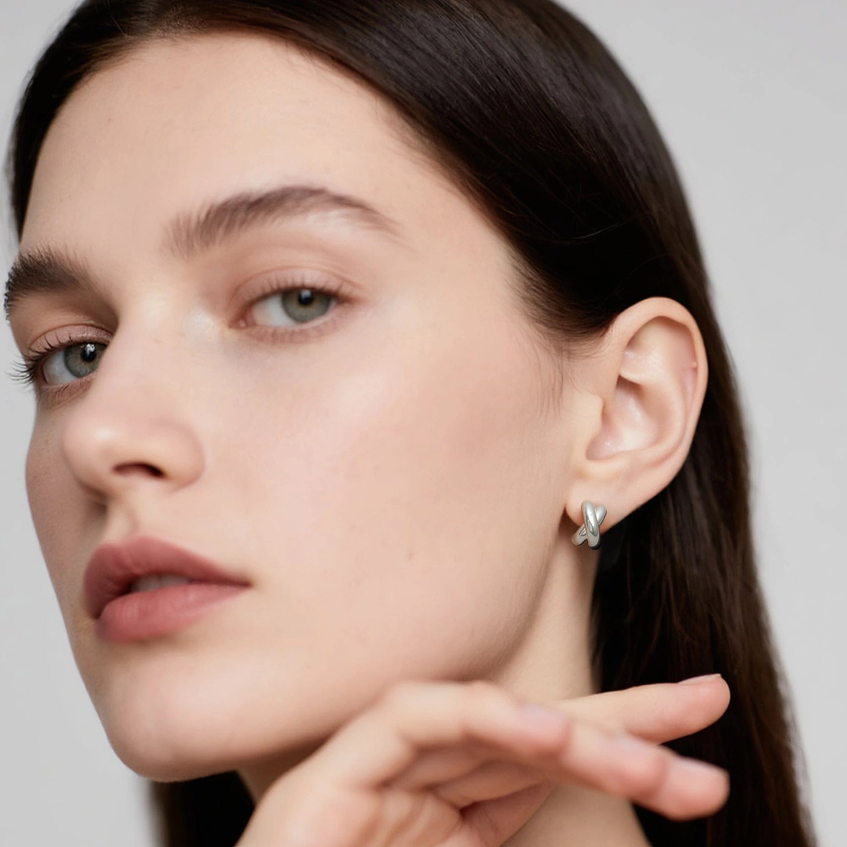 Dainty rhodium vermeil everyday twist huggie hoop earrings with modern texture, hypoallergenic sterling silver designed by Hermin
