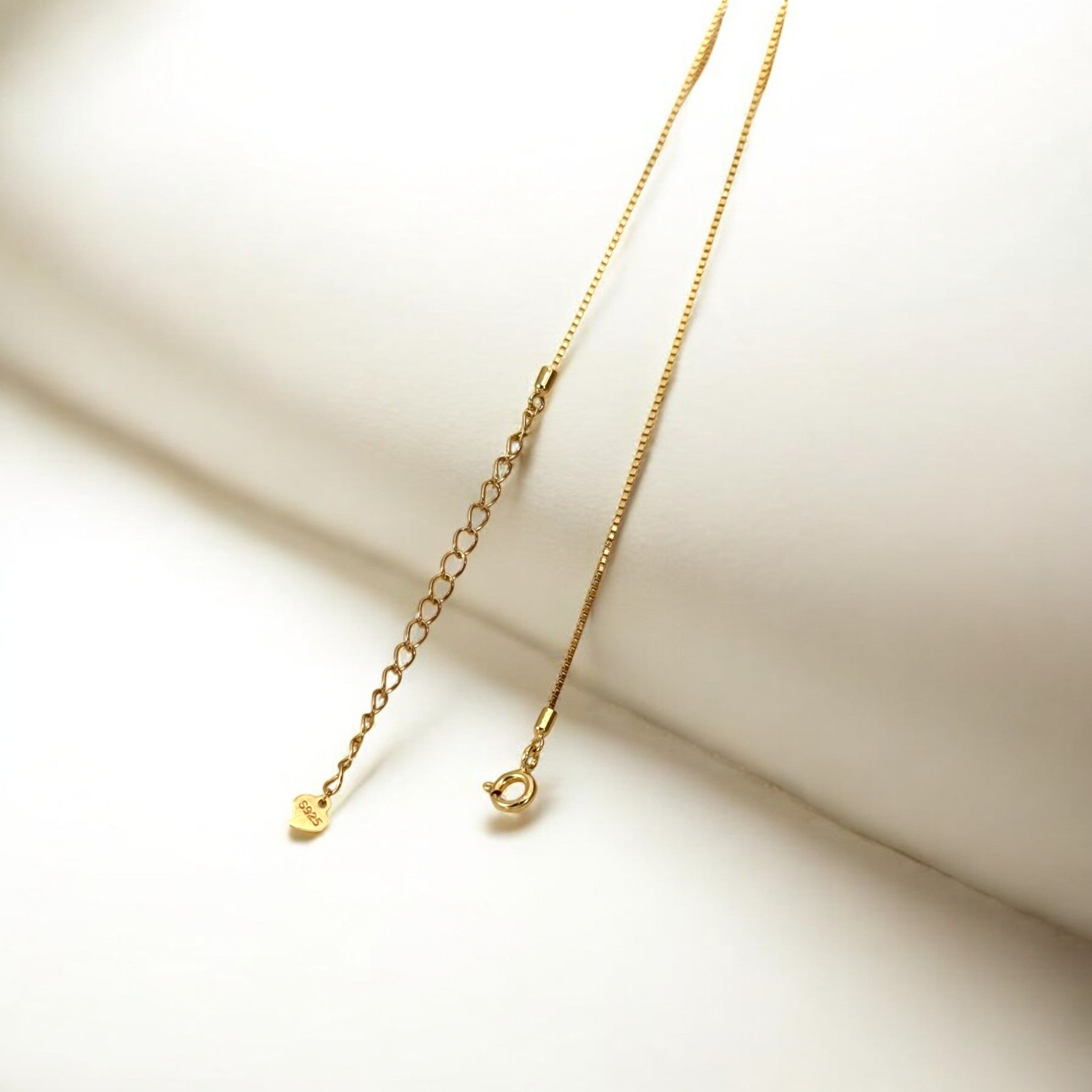 Close-up of Hermin's Gold Kinetic Bar Necklace - Dew in 18k gold vermeil over sterling silver, crafted for elegance and durability