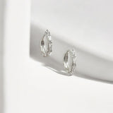 Tapered Baguette Silver Huggie Hoops made from sterling silver with rhodium finish, minimalist design by Hermin Jewelry