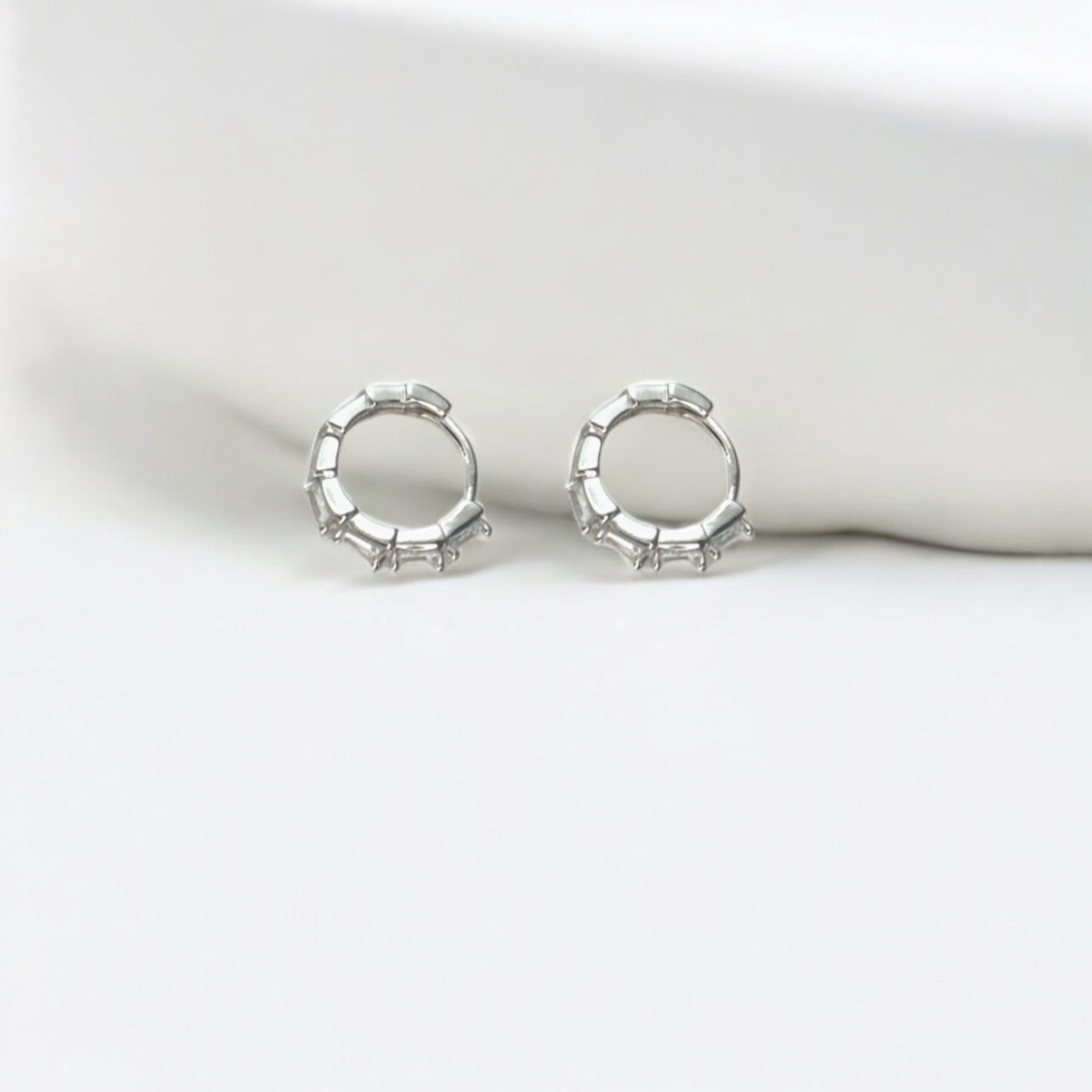 Tapered Baguette Silver Huggie Hoops crafted with premium sterling silver with rhodium finish, hypoallergenic and tarnish-resistant