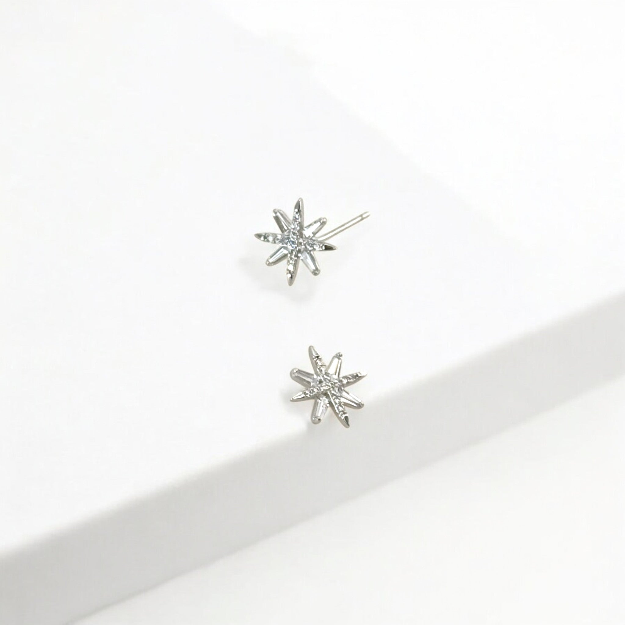 North Star Silver Stud Earrings made from sterling silver with rhodium finish, minimalist design by Hermin Jewelry