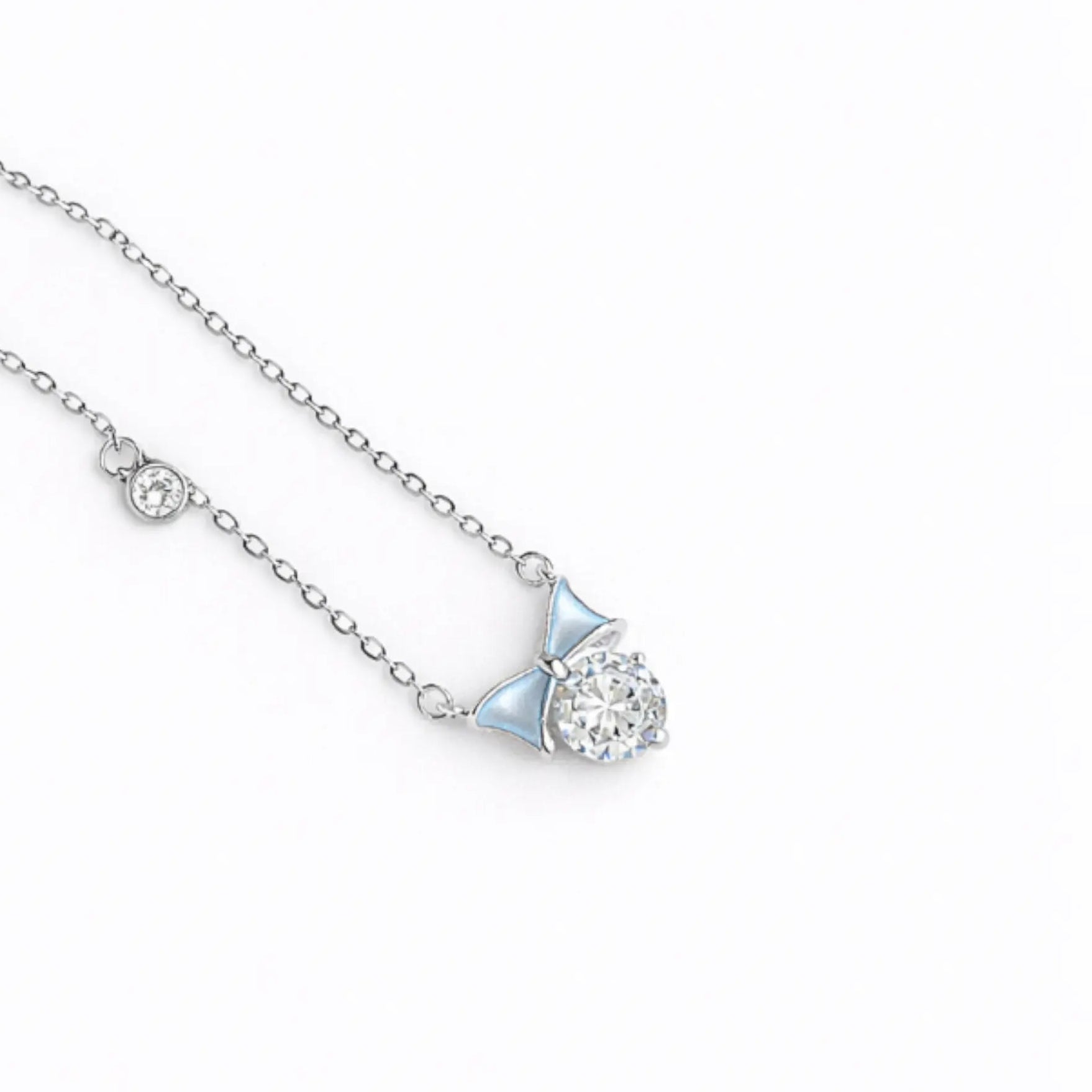 Blue enamel mini bow necklace in silver with crystal accents
