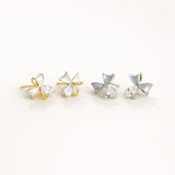 Dainty gold bow earrings with white enamel and crystals, hypoallergenic studs