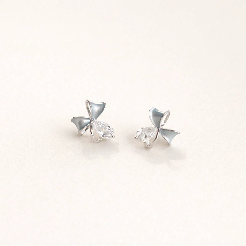 Silver mini bow stud earrings for women with blue enamel and crystal accents