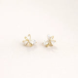 Gold mini bow stud earrings for women with white enamel and crystal accents