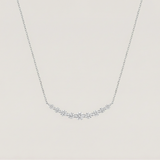Dainty silver crescent necklace with graduated moissanite bar, modern minimalist jewelry