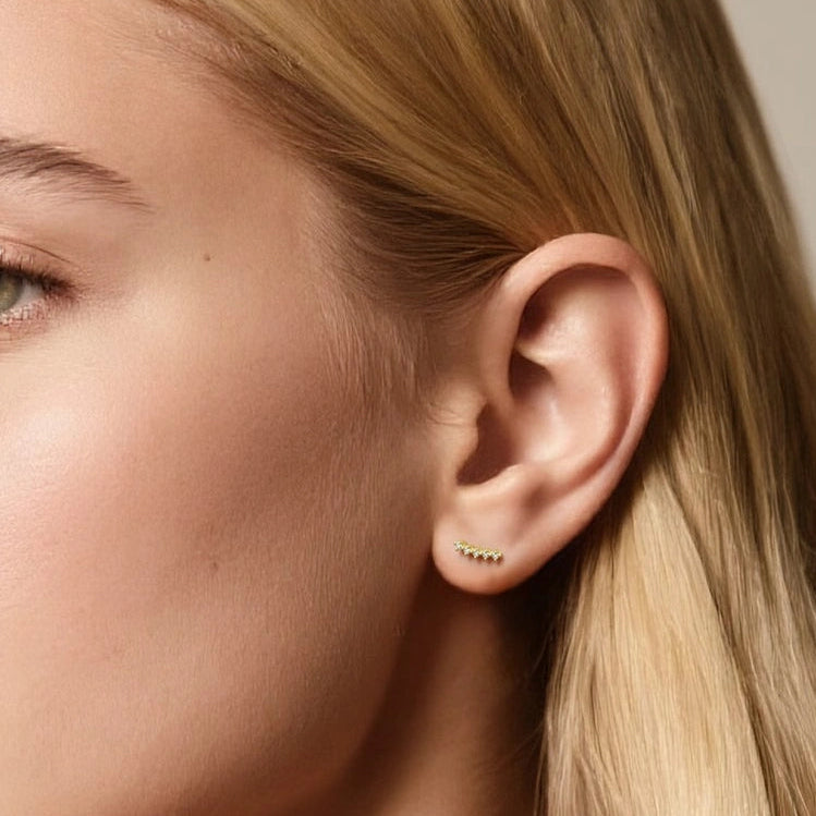 Model wearing threaded screw-back climber stud earrings
