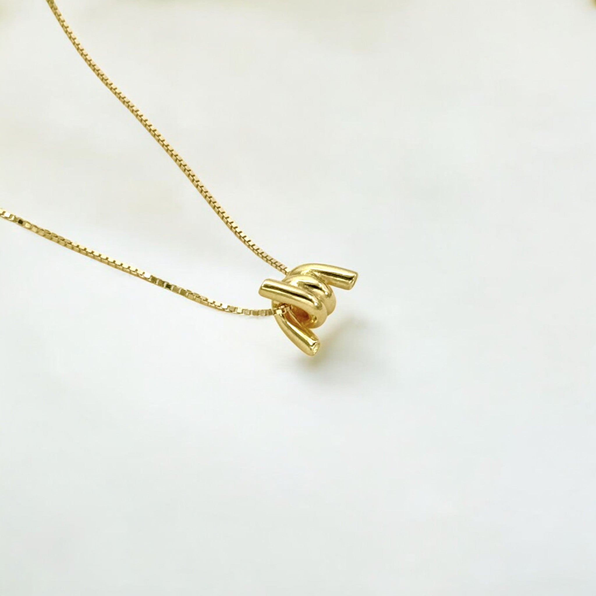 Torque Knot Gold Necklace made from 18k gold vermeil over sterling silver, minimalist design by Hermin Jewelry