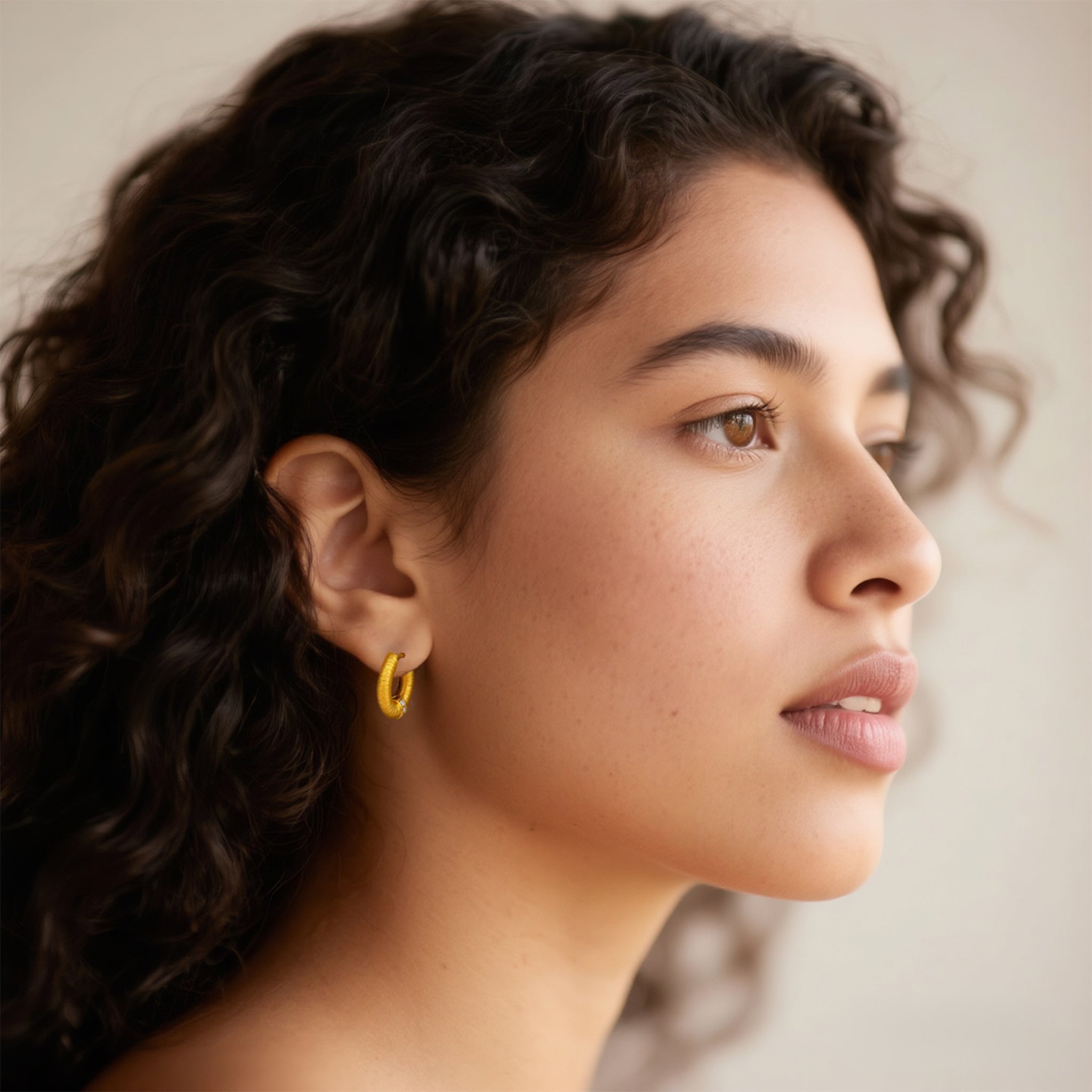 Close-up of Hermin's Tulle Gold Sparkle Everyday Hoops in 18k gold vermeil over sterling silver, crafted for elegance and durability