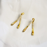 Macro close-up of CZ pavé setting on Aurelia gold vermeil drop earrings, highlighting sparkle and polished finish