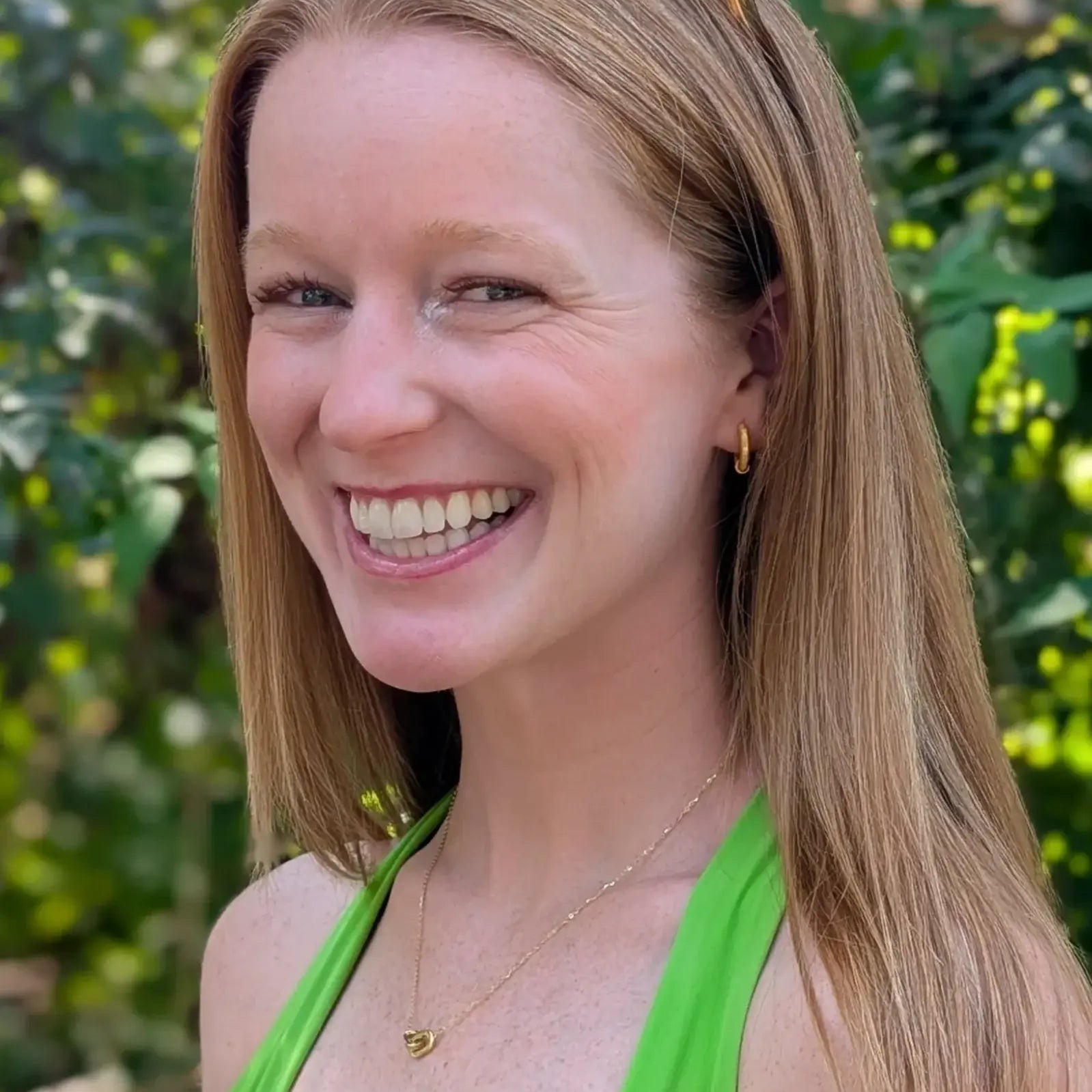 women in a delightful, effortless daily look paired with gold sparkle earring and dainty effortless pave link necklace